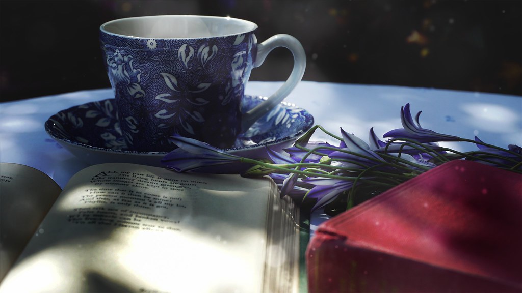 Poetry book with tea and treats, representing Brave Writer's Poetry Teatime tradition