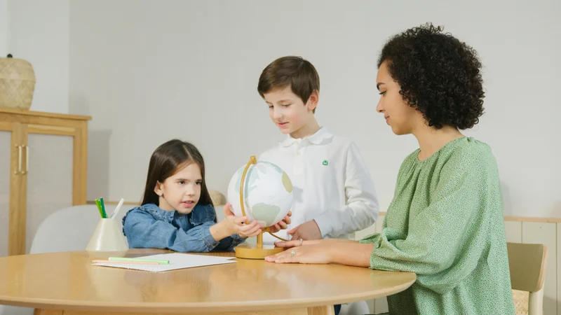 Multiple children learning geography together during combined homeschool lesson