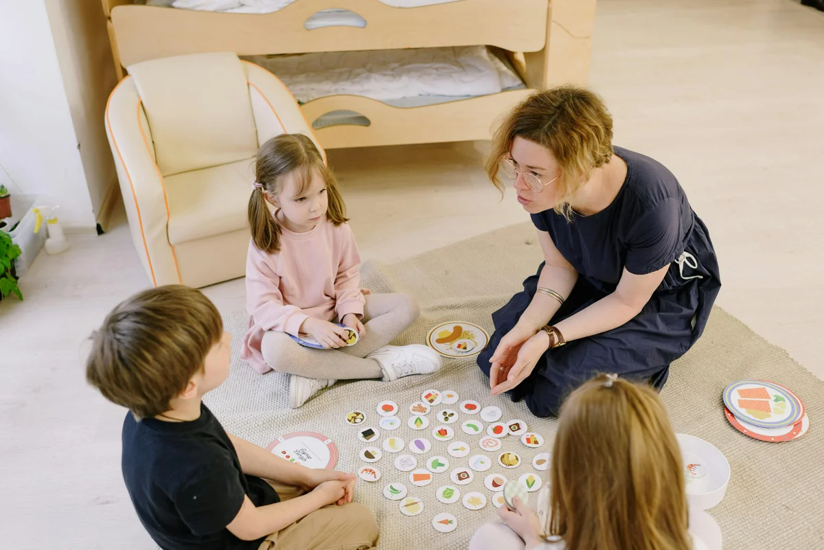Family enjoying educational board game activity during homeschool learning time