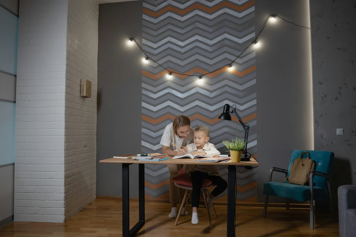 Mother helping her son with homeschool studies at home in North Dakota