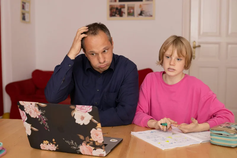 Parent helping child with homeschool work showing common frustrations