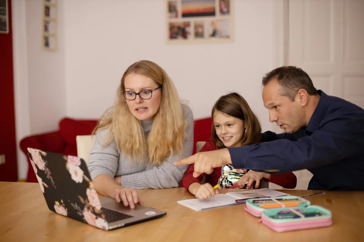 Family learning together at home comparing homeschooling and private school education options