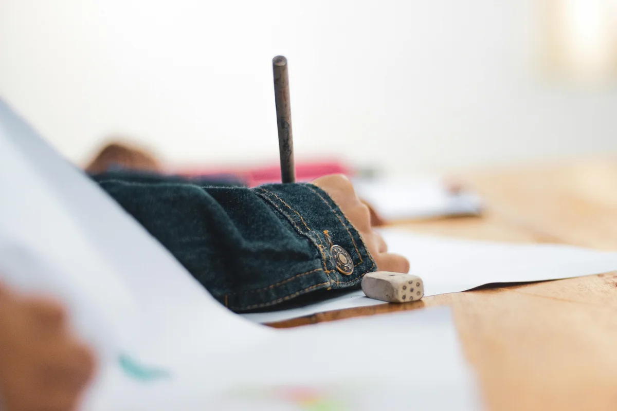 Child drawing during homeschool art lesson in Iowa