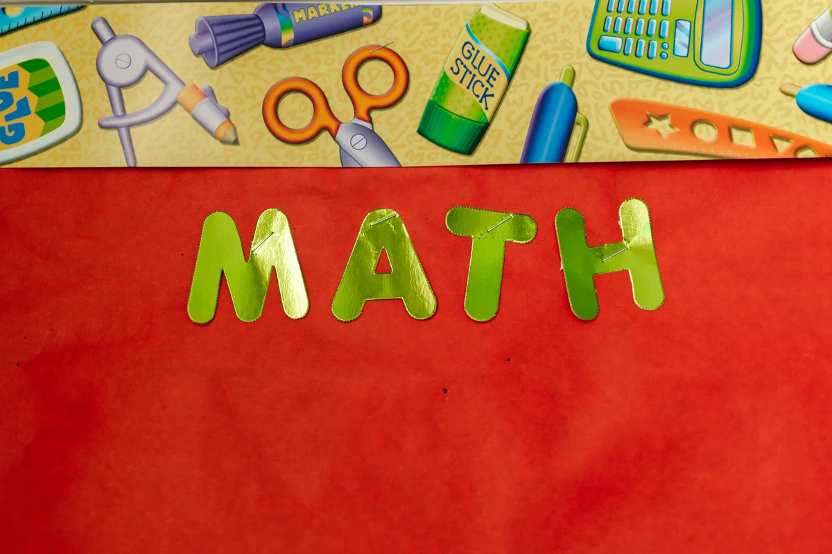 Colorful math education banner with school supplies illustration