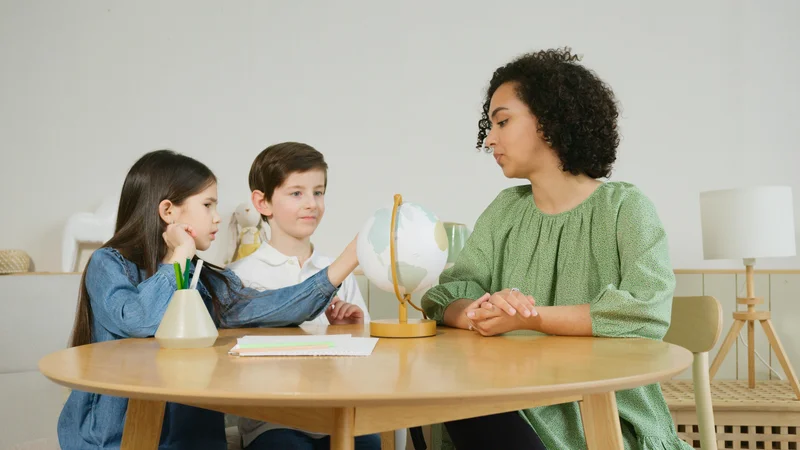 Children learning geography with a globe in Minnesota homeschool setting