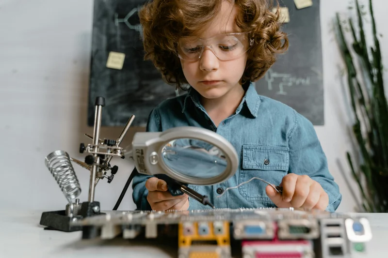 Child doing hands-on electronics learning in Minnesota homeschool